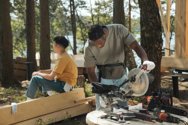two men wood working